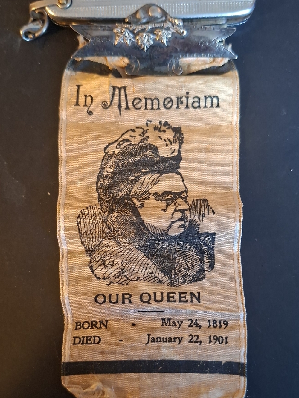 In Memoriam Our Queen Silk Memorial Ribbon - Beige and Black On Silver Brooch